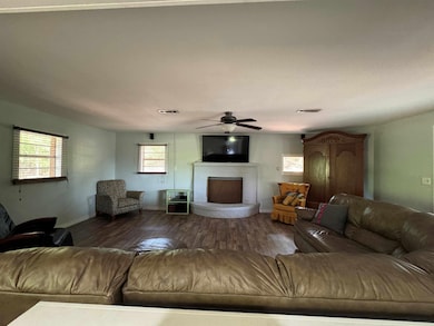 large living room open to dining, fireplace, laminate flooring new. very large.