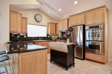 Custom chef's kitchen with plenty of storage, stai