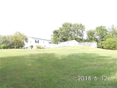 Back view of fenced pool & house