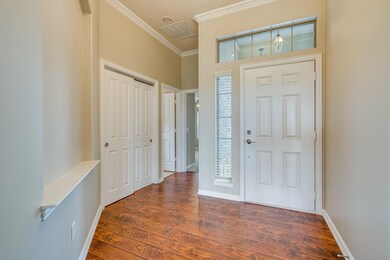 Foyer with visible vents, ornamental molding, base