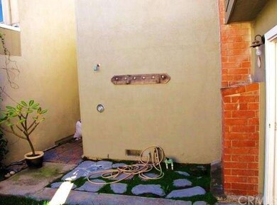 Private patio with outdoor shower.