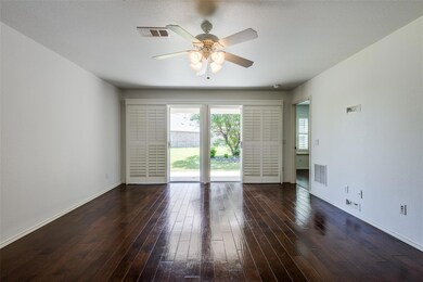 Living room with wood floors and double sliding gl