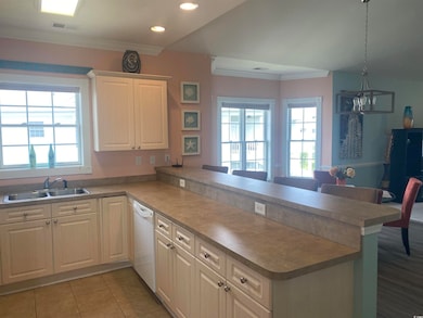Kitchen with light tile patterned flooring, decora