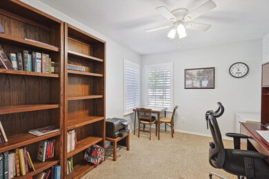Home office featuring ceiling fan and light colore
