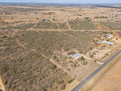Aerial overview of property's location featuring rural landscape