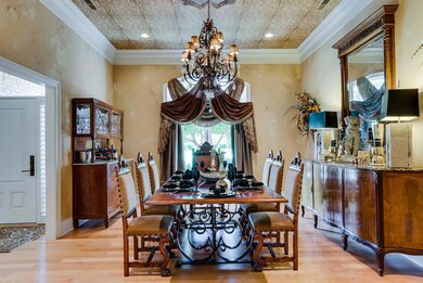 Formal dining room.  You must come and see the many designer additions in this home. Notice the ceiling!