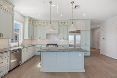 The kitchen is a chef’s dream, featuring Wolf/Subz