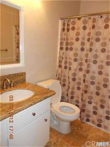 Upstairs hallway full bathroom with new granite co