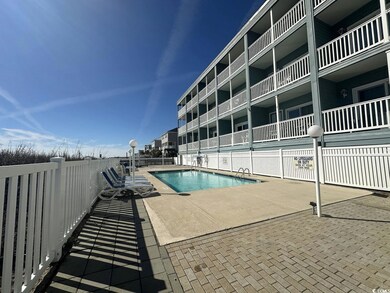 Pool with fence and a patio area