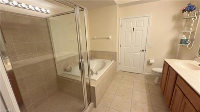 Bathroom featuring tile patterned flooring, double
