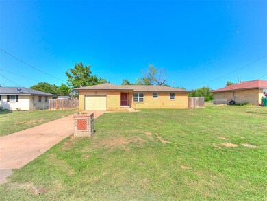 Single story home featuring a garage and a front l