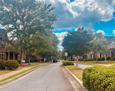 View of street with traffic signs, a residential view, sidewalks, and curbs
