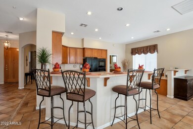 Open kitchen with bar seating