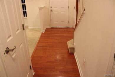 Hallway/Foyer with hardwood flooring with light wo