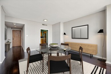 Dining area shown open to the entry and kitchen. I