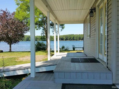 Covered porch entry looking west.