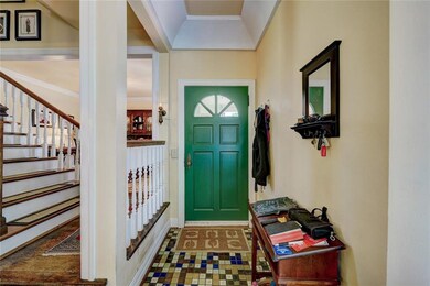 Inside view of front door, entry and stairway