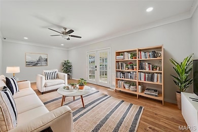 Family room with French doors leading to covered patio is the perfect setting for every day's events. Virtually Staged