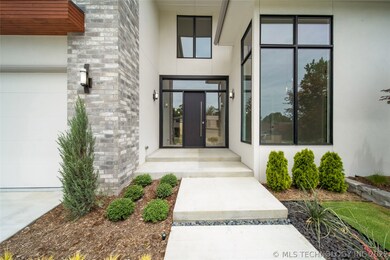 Beautiful landscaping and covered porches off of t