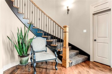 Gracious 2-story entry with curved staircase.  Wal