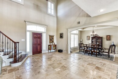 This home is designed to fell much larger than its 3500 square feet.  Family spaces are accented by detailed wood finishes, Versailles pattern travertine floors, and crown moldings/