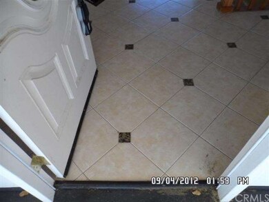 Ceramic tile entry to hallway, and to kitchen.