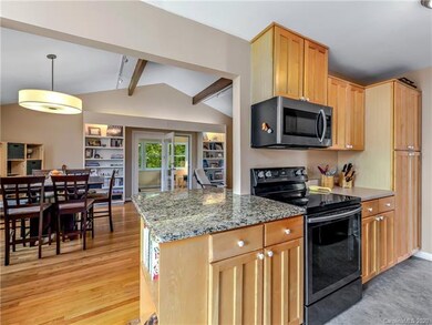 The open-concept main living space connects the ki