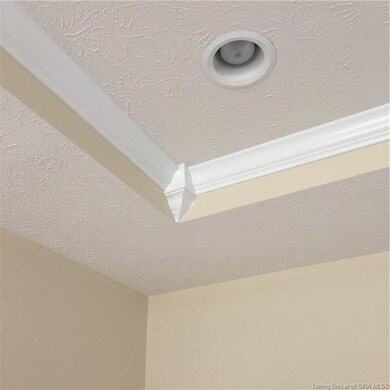 Great room has a trey ceiling with recess lights, 