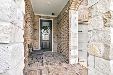Covered and welcoming entry. Love the stone accent