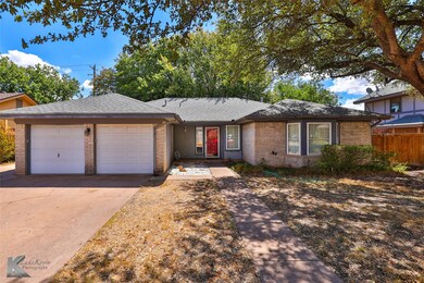 Ranch-style house featuring a garage