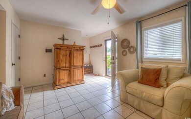 Living room with light tile patterned flooring and