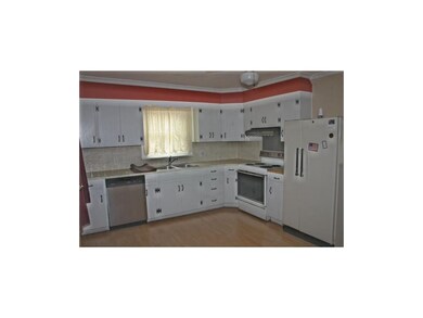 Kitchen - Dishwasher, stove and refrigerator stay.