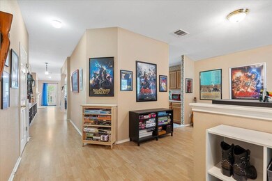 Hall with light wood-type flooring and baseboards