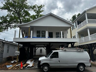 Beach home featuring a carport