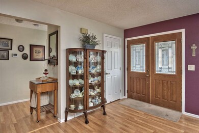 Leaded-glass double front doors welcome you into a