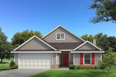 Craftsman-style home with a front lawn and a garag