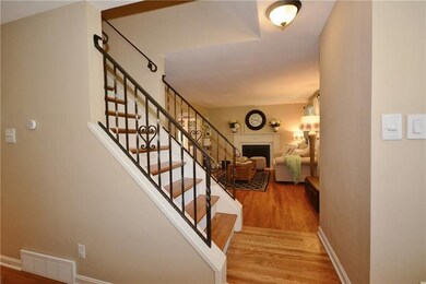 Gorgeous hardwood floors and rod iron bannister