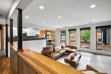 Living area featuring recessed lighting and tile 