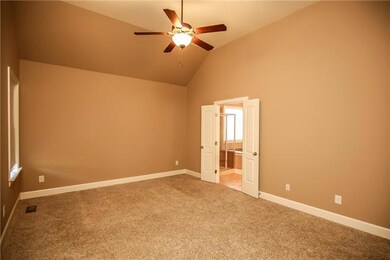 Main level master bedroom features Levelor blinds.