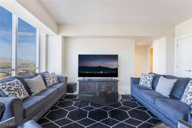 Living area featuring baseboards and carpet floors