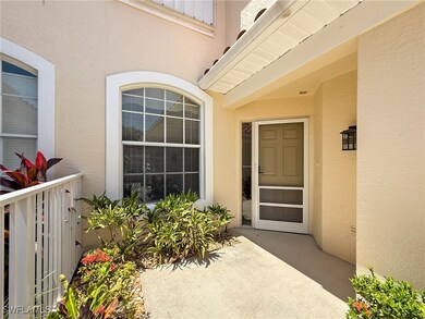 Property entrance featuring stucco siding