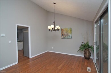 Dining room with wood floors and walk out to the p