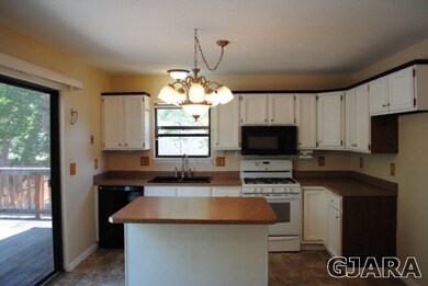 kitchen with island, updated gas stove, microwave 