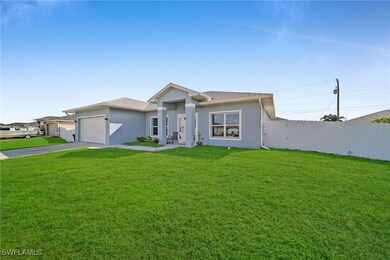 View of front of house featuring driveway, stucco
