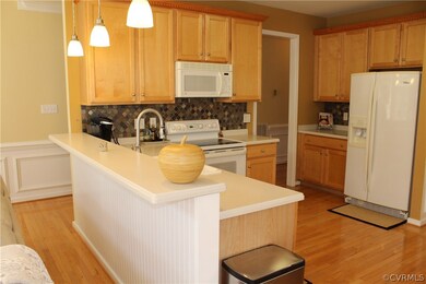 Kitchen, Corian breakfast bar with three pendant l