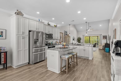 Kitchen featuring a center island, decorative back