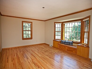 Large living room with built in window seat and ne