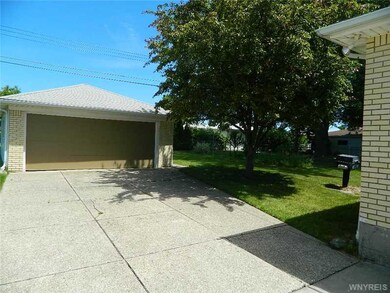 Exterior Front. 2 car garage with garage door open