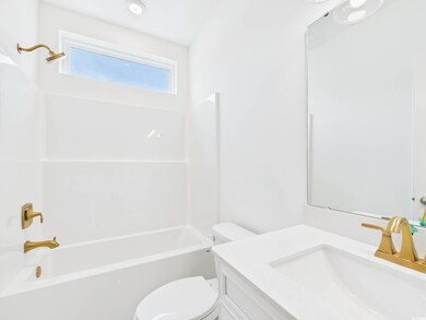 Full bathroom with toilet, vanity, and bathtub / shower combination