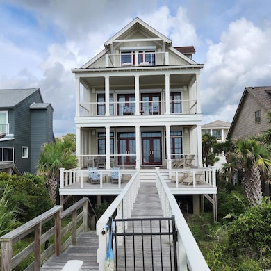Rear view of property featuring french doors and board and batten siding